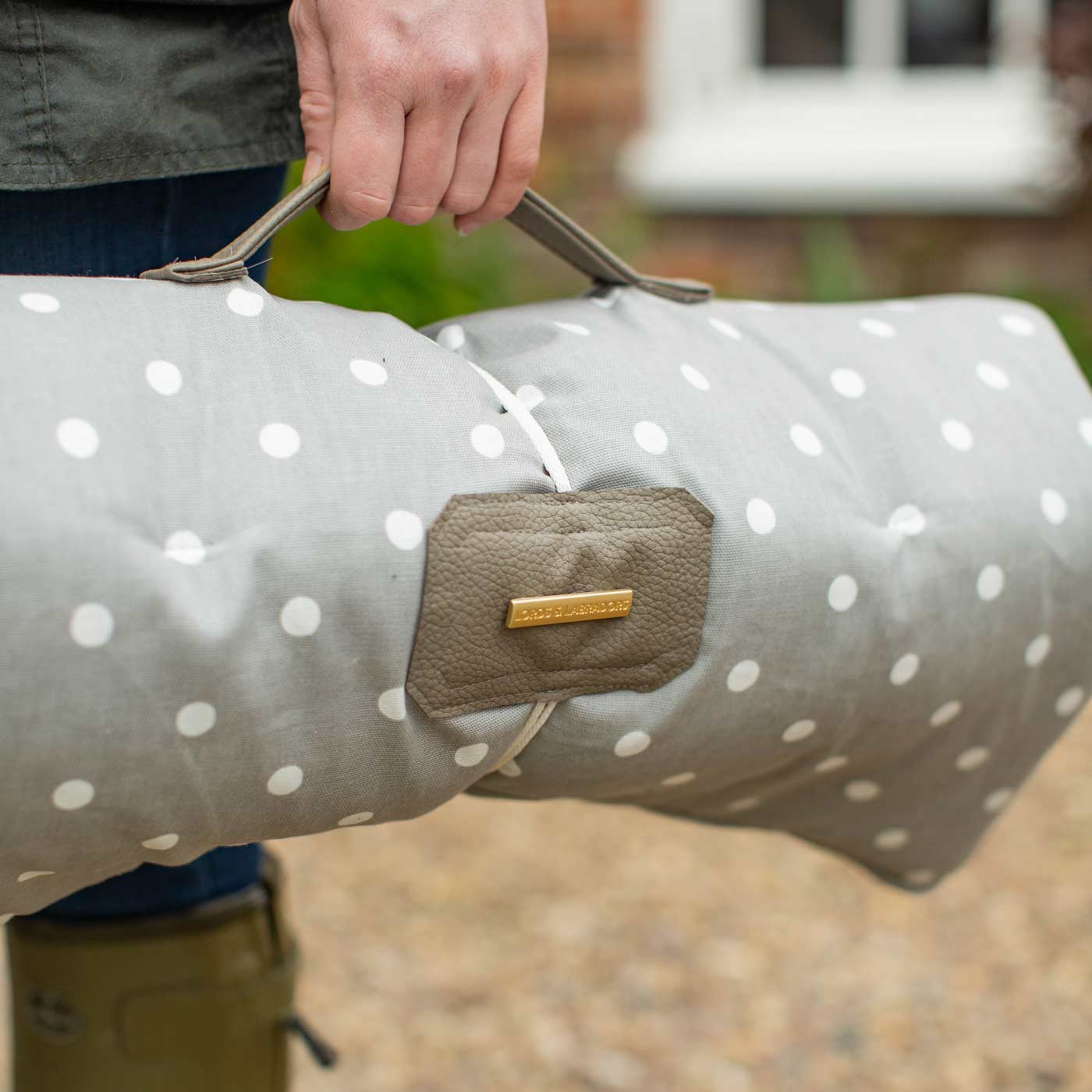 Embark on the perfect pet travel with our luxury Travel Mat in Grey Spot. Featuring a Carry handle for on the move once Rolled up for easy storage, can be used as a seat cover, boot mat or travel bed! Available now at Lords & Labradors